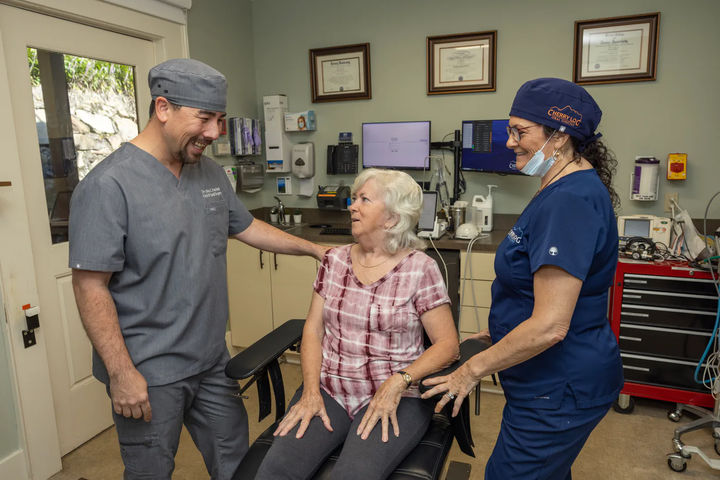 Dr. Pritchett and his surgical assistant caring for a patient