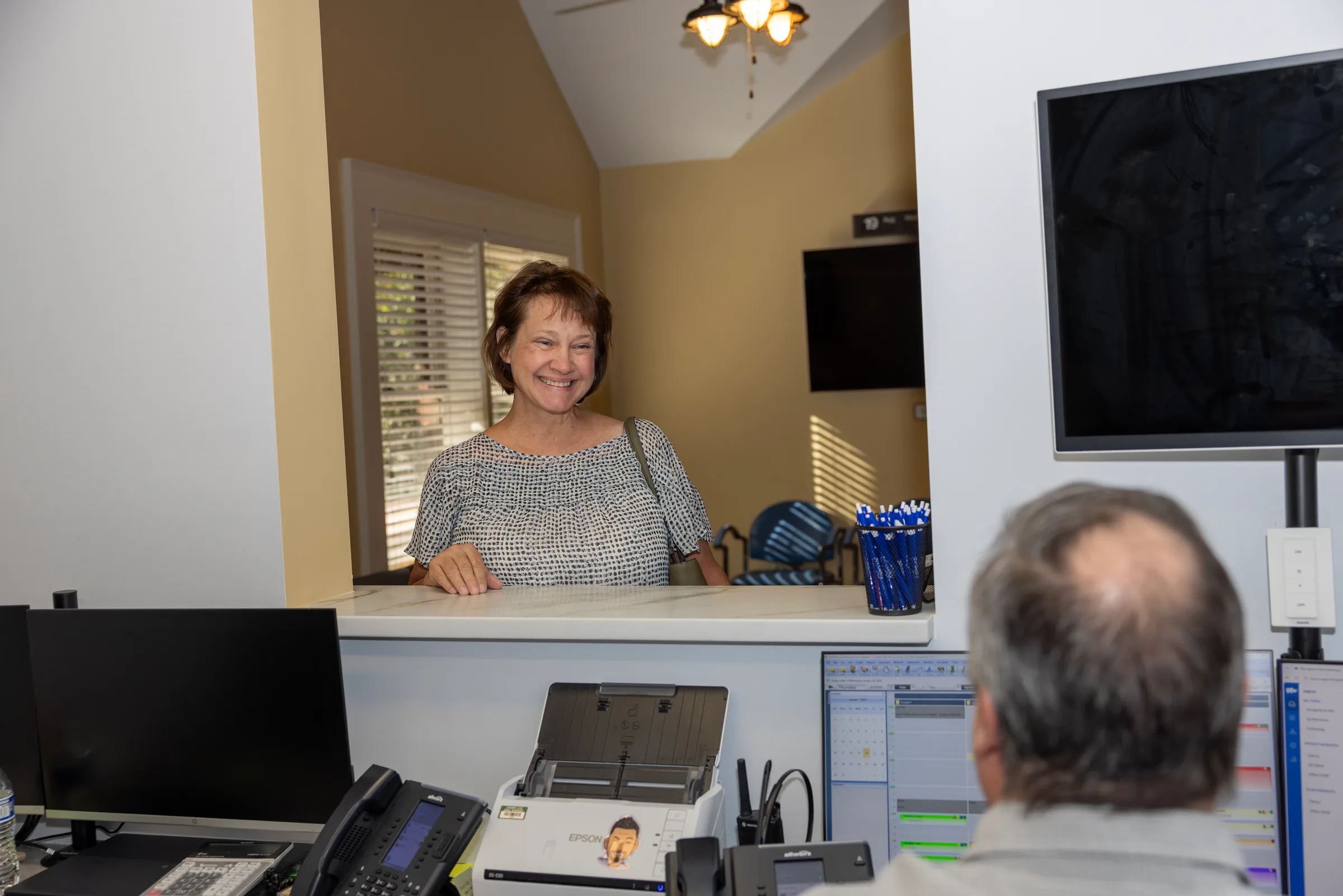 Patient checking in at the Cherry Log Oral Surgery front desk